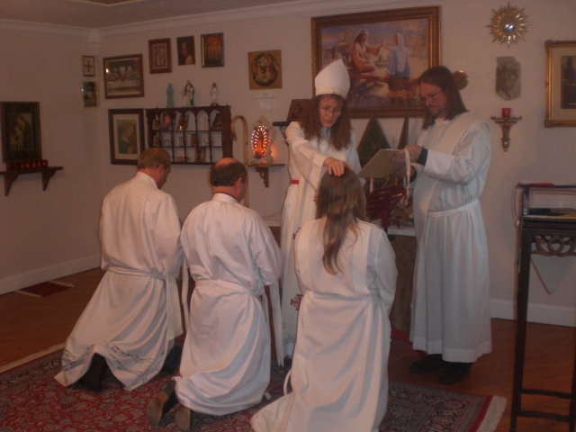 Bishop Katia Ordaining Deacons by laying on of hands January 2010 in Holy Family Chapel Gainesville Florida